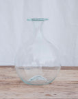 Round hand blown carafe with a lipped top. Handblown in Paris by La Soufflerie.